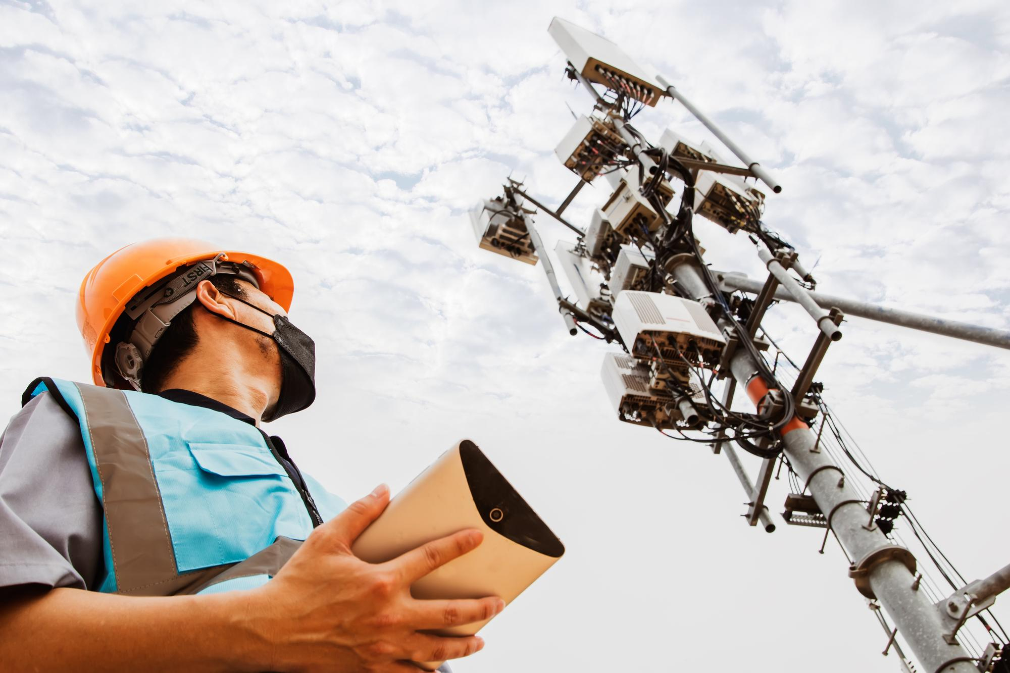 asian-male-electrician-worker-professional-works-tower-inspect-telecommunication-tower